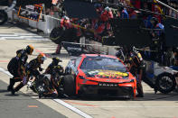 Martin Truex Jr. makes a pit stop during a NASCAR Cup Series auto race at Dover Motor Speedway, Sunday, April 28, 2024, in Dover, Del. (AP Photo/Derik Hamilton)