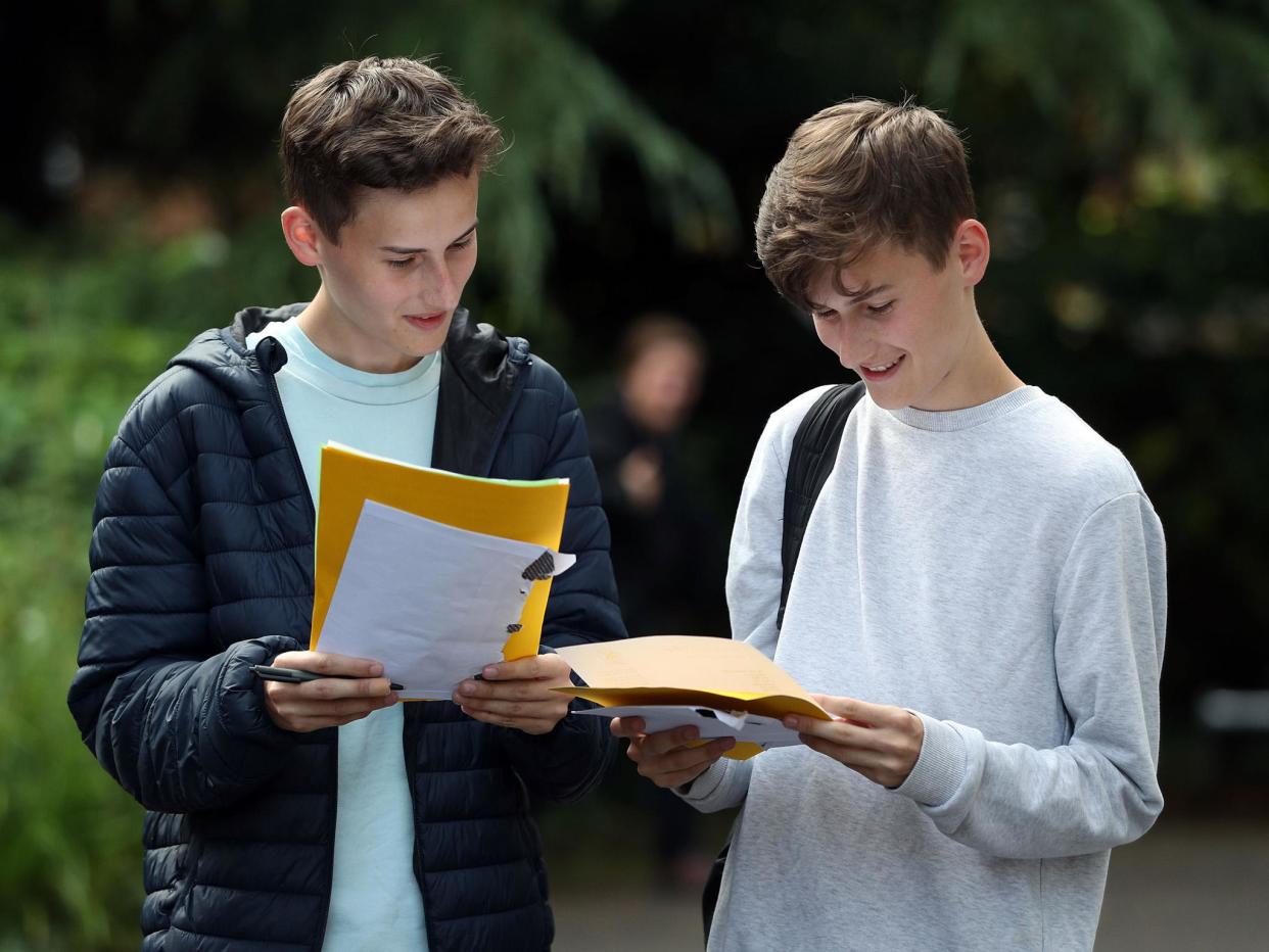 Twin Students James (left) and Toby Houston collect their A-level results at Peter Symonds college in Winchester, Hampshire: PA