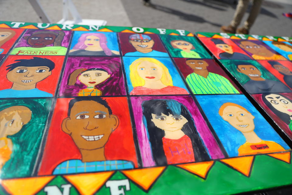 <p>Art featuring the faces of many people of different backgrounds on the “Being accepted” table in Union Square Park in New York City on June 5, 2018. (Photo: Gordon Donovan/Yahoo News) </p>