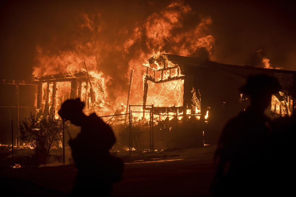 <p>Flames from a wildfire consume a residence near Oroville, Calif., on Sunday, July 9, 2017. Evening winds drove the fire through several neighborhoods leveling homes in its path. (AP Photo/Noah Berger) </p>