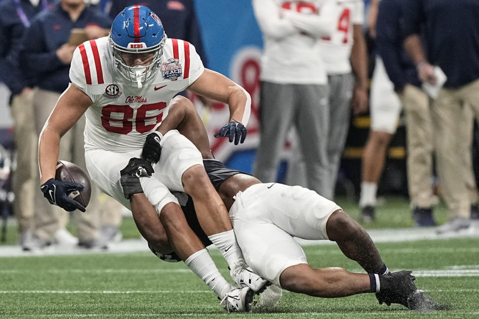 Mississippi tight end Caden Prieskorn (86) is hit by Penn State linebacker Kobe King (41) during the first half of the Peach Bowl NCAA college football game, Saturday, Dec. 30, 2023, in Atlanta. (AP Photo/Brynn Anderson)