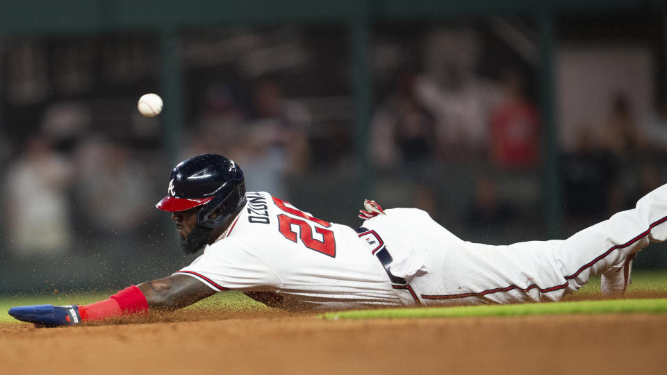 Atlanta Braves Marcell Ozuna (20) slides into second base during the ninth inning of a baseball game against the San Francisco Giants Wednesday, June 22, 2022, in Atlanta. (AP Photo/Hakim Wright Sr.)