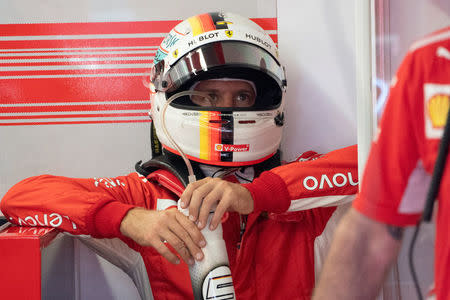 Sebastian Vettel sits and takes a drink at Circuit Gilles Villeneuve during a practice session for the F1 race in Montreal, Quebec, Canada, June 8, 2018. REUTERS/Carlo Allegri