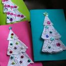 <p>A few careful folds, and you've got yourself a tree that looks gorgeous in its winter whites. Then, stick on "ornaments" to your heart's content.</p><p><em><a href="https://happyhooligans.ca/doily-christmas-tree-cards-for-kids-to-make/" rel="nofollow noopener" target="_blank" data-ylk="slk:Get the tutorial at Happy Hooligans »;elm:context_link;itc:0;sec:content-canvas" class="link ">Get the tutorial at Happy Hooligans »</a></em></p>