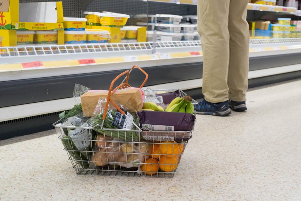 Shoppers at supermarket Sainsbury's for their weekly shopping when special prices are on offer, dealing with the cost of living crisis in UK