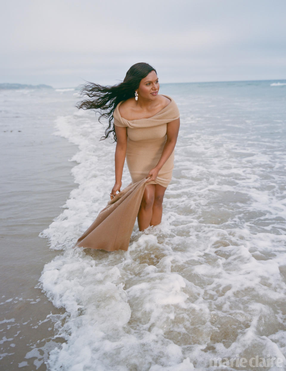 Mindy Kaling at the edge of the ocean