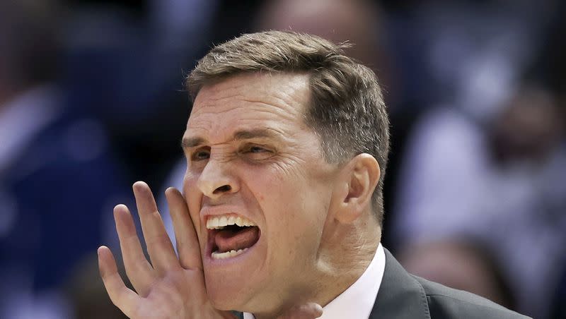 UVU Basketball Coach Mark Madsen screams plays during the game against BYU at BYU in Provo on Wednesday, Dec. 7, 2022.