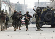 <p>Afghan security forces arrive at the site of a blast and gun fire in Jalalabad, Afghanistan, Jan. 24, 2018. (Photo: Parwiz/Reuters) </p>