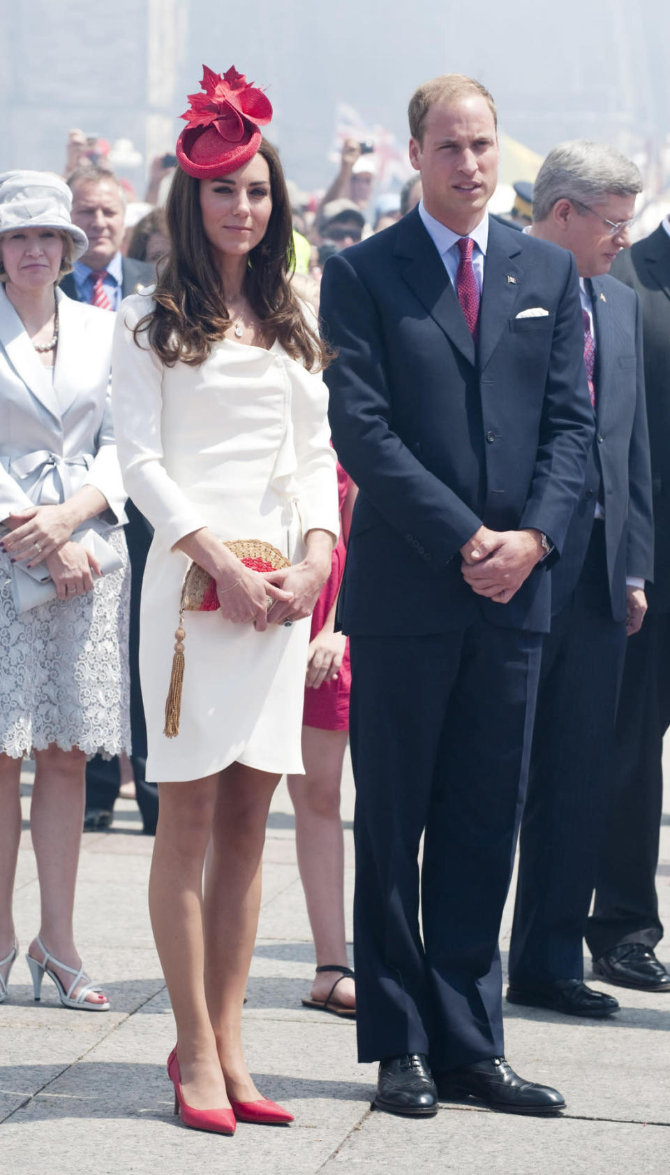 <p>For Canada Day, Kate opted for a white dress from Reiss paired with a red Lock & Co fascinator, Anya Hindmarch’s fan clutch and red heels from Hobbs.</p><p><i>[Photo: PA]</i></p>
