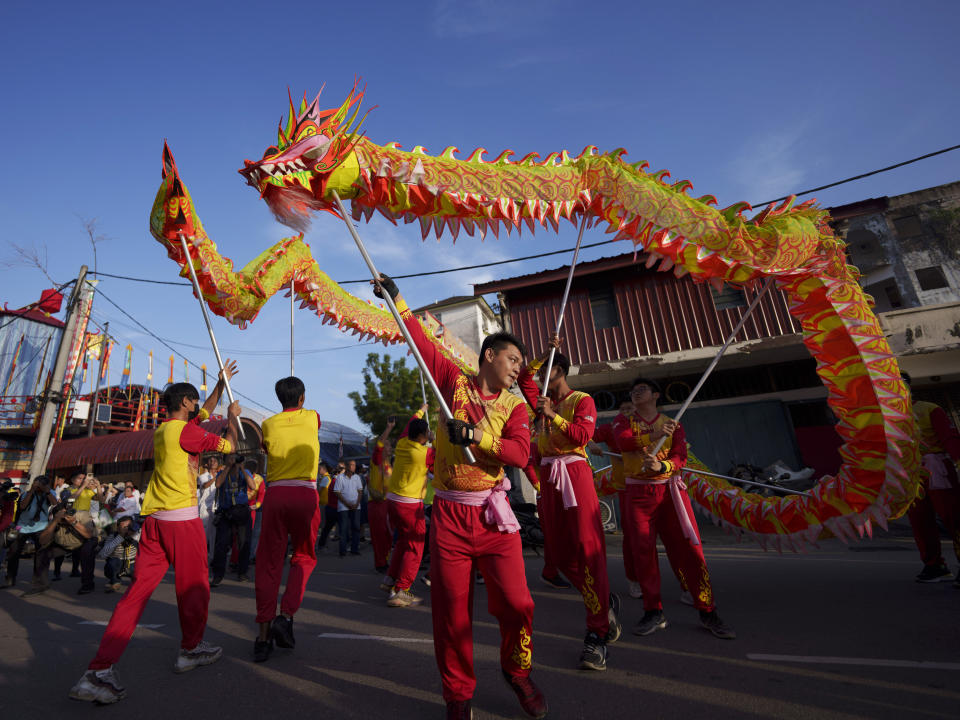 Dragon dance performance during a procession for Wangkang or "royal ship" festival at Yong Chuan Tian Temple in Malacca, Malaysia, Thursday, Jan. 11, 2024. The Wangkang festival was brought to Malacca by Hokkien traders from China and first took place in 1854. Processions have been held in 1919, 1933, 2001, 2012 and 2021. (AP Photo/Vincent Thian)