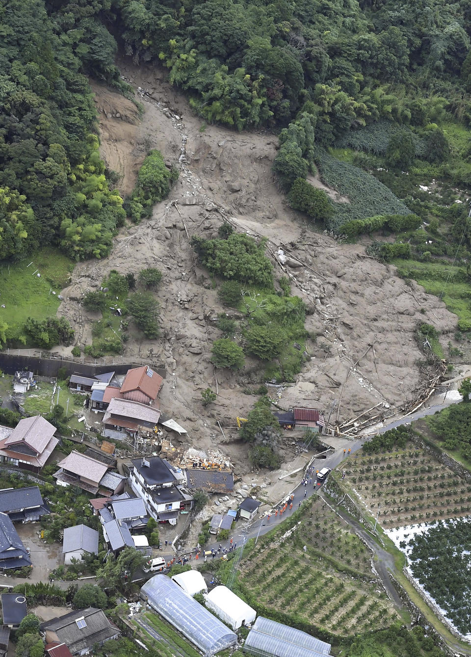 This shows the site of a landslide in Karatsu, Saga prefecture, southern Japan Monday, July 10, 2023. Torrential rain has been pounding southwestern Japan, triggering floods and mudslides. (Kyodo News via AP)
