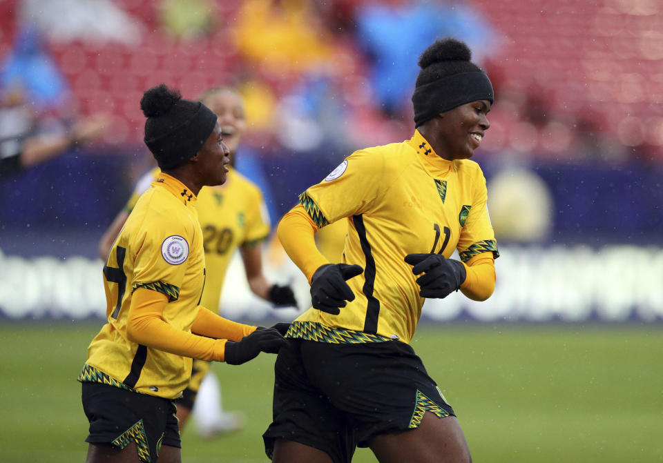 Jamaica midfielder Deneisha Blackwood (14) celebrates the goal by midfielder Khadija Shaw (11) during the first half against Panama in the third place match of the CONCACAF women's World Cup qualifying tournament, Wednesday, Oct. 17, 2018, in Frisco, Texas. (AP Photo/Richard W. Rodriguez)
