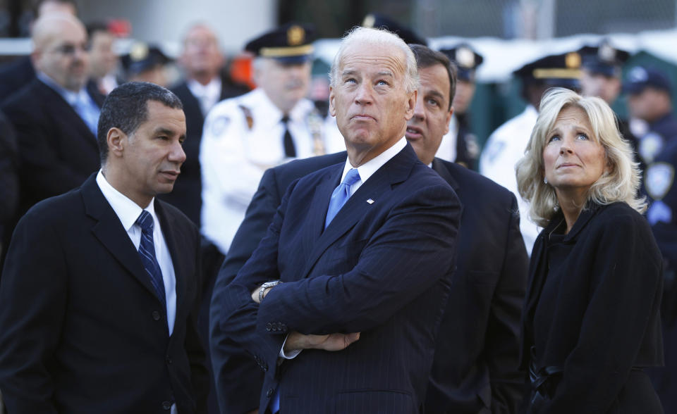 U.S. Vice President Joe Biden (C) and his wife Jill (R) look up at 1 World Trade Center with New York Governor David Paterson (L) and New Jersey Governor Chris Christie at Ground Zero during the ceremony marking the ninth anniversary of the September 11 attacks on the World Trade Center in New York September 11, 2010.  REUTERS/Lucas Jackson (UNITED STATES - Tags: DISASTER ANNIVERSARY POLITICS)