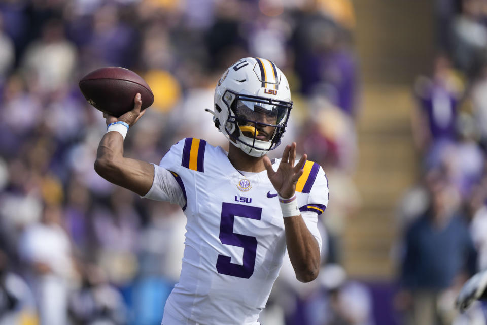 LSU quarterback Jayden Daniels (5) passes in the first half of an NCAA college football game against Texas A&M in Baton Rouge, La., Saturday, Nov. 25, 2023. (AP Photo/Gerald Herbert)