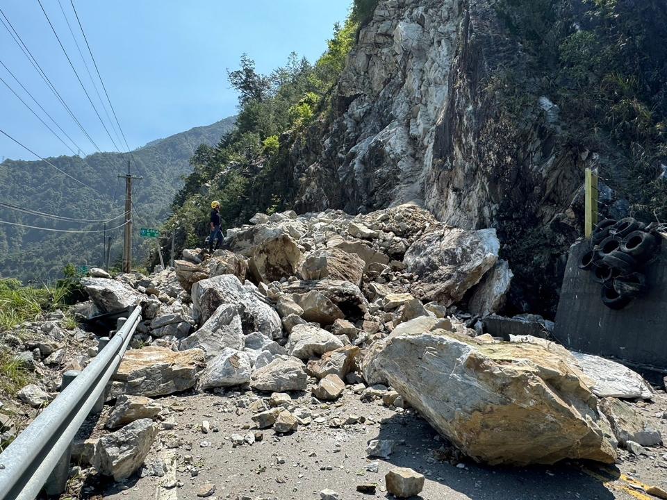 TOPSHOT - This handout photo from the Taichung City Government's Fire Bureau taken and released on April 3, 2024 shows rocks blocking part of the road on a section of a highway in Taichung, after a major earthquake hit Taiwan's east. At least seven people were killed and more than 700 injured on April 3 by a powerful earthquake in Taiwan that damaged dozens of buildings and prompted tsunami warnings that extended to Japan and the Philippines before being lifted.