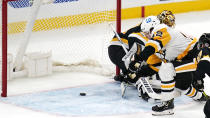 Pittsburgh Penguins right wing Kasperi Kapanen (42) scores on Boston Bruins goaltender Tuukka Rask during the third period of an NHL hockey game, Tuesday, Jan. 26, 2021, in Boston. (AP Photo/Charles Krupa)