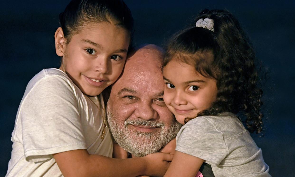 Steven Bender, 52, with two of his daughters, Rihanna, 5, and Raven, 4, on the right. THOMAS BENDER/HERALD-TRIBUNE