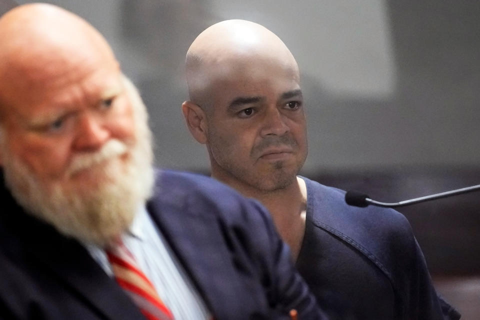 Clark County Public Administrator Robert "Rob" Telles, right, appears in court with attorney Travis E. Shetler, left, Thursday, Sept. 8, 2022, in Las Vegas. Telles was arrested Wednesday in the fatal stabbing of Las Vegas Review-Journal reporter Jeff German, whose investigations of the official's work preceded his primary loss in June. (AP Photo/John Locher)