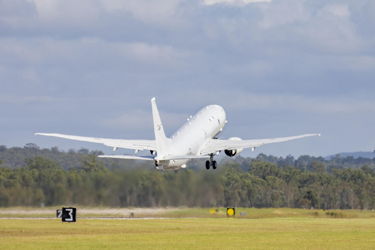 In this photo provided by the Australian Defense Force a Royal Australian Air Force P-8 Poseidon aircraft departs an airbase in Amberly, Australia, Monday, Jan. 17, 2022, to assist the Tonga government after the eruption of an undersea volcano. (LACW Emma Schwenke/ADF via AP)