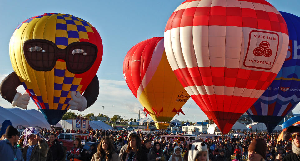 In this Oct. 8, 2011 photo, hot air balloons are shown at the Albuquerque International Balloon Fiesta before take off. The 41st annual event is set to begin Saturday and is expected to draw hundreds of thousands of spectators from around the country and the global. (AP Photo/Russell Contreras)