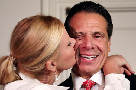New York Governor Andrew Cuomo is kissed by his girlfriend Sandra Lee after voting in the New York Democratic primary election at the Presbyterian Church in Mt. Cisco, New York, U.S., September 13, 2018. REUTERS/Mike Segar