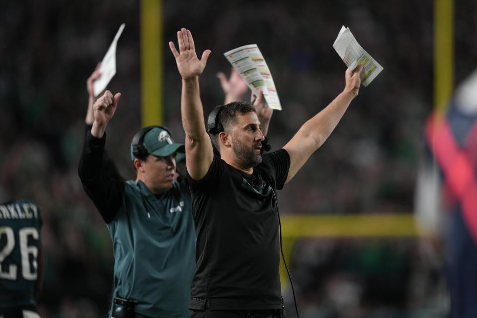 Philadelphia Eagles head coach Nick Sirianni and Kellen Moore, offensive coordinator react to a two-point conversion by Eagles running back Saquon Barkley during the second half of an NFL football game against the Atlanta Falcons on Monday, Sept. 16, 2024, in Philadelphia. (AP Photo/Matt Slocum)