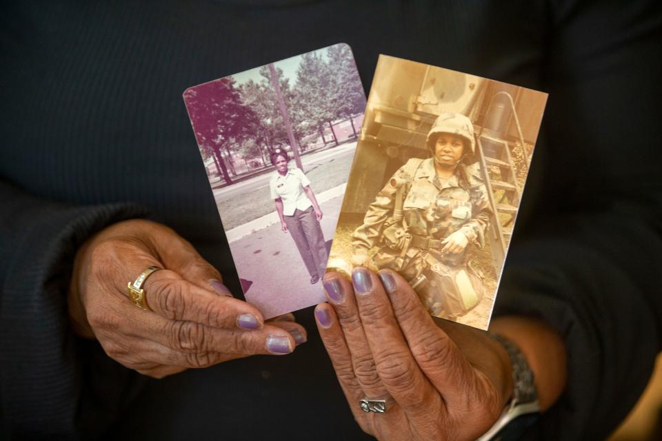 Veronica Miller, a Desert Shield/Desert Storm veteran who will be presented the Quilt of Valor on October 15th, holds two images of herself training in the National Guard in the 1980s at her home in Neptune, NJ Monday, October 10, 2022. 