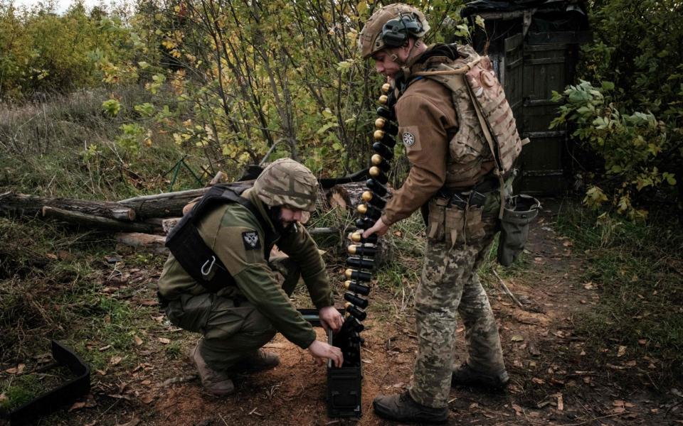 Ukrainian troops put ammunition into a crate before setting a US-made MK-19 automatic grenade launcher near Toretsk, Donetsk - YASUYOSHI CHIBA/AFP