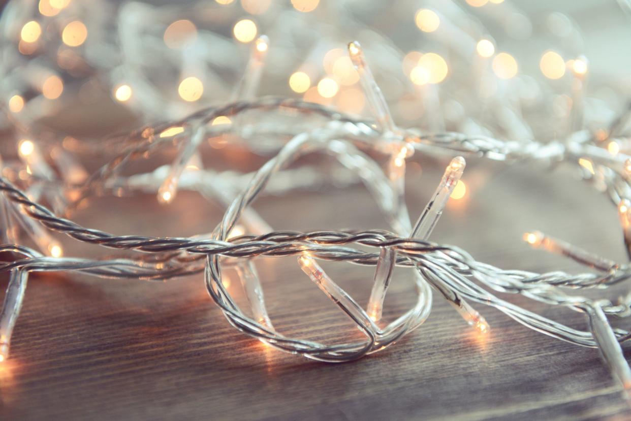 Christmas lights on wooden background