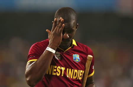 Cricket - England v West Indies - World Twenty20 cricket tournament final - Kolkata, India - 03/04/2016. West Indies captain Darren Sammy walks off the field after his dismissal. REUTERS/Adnan Abidi