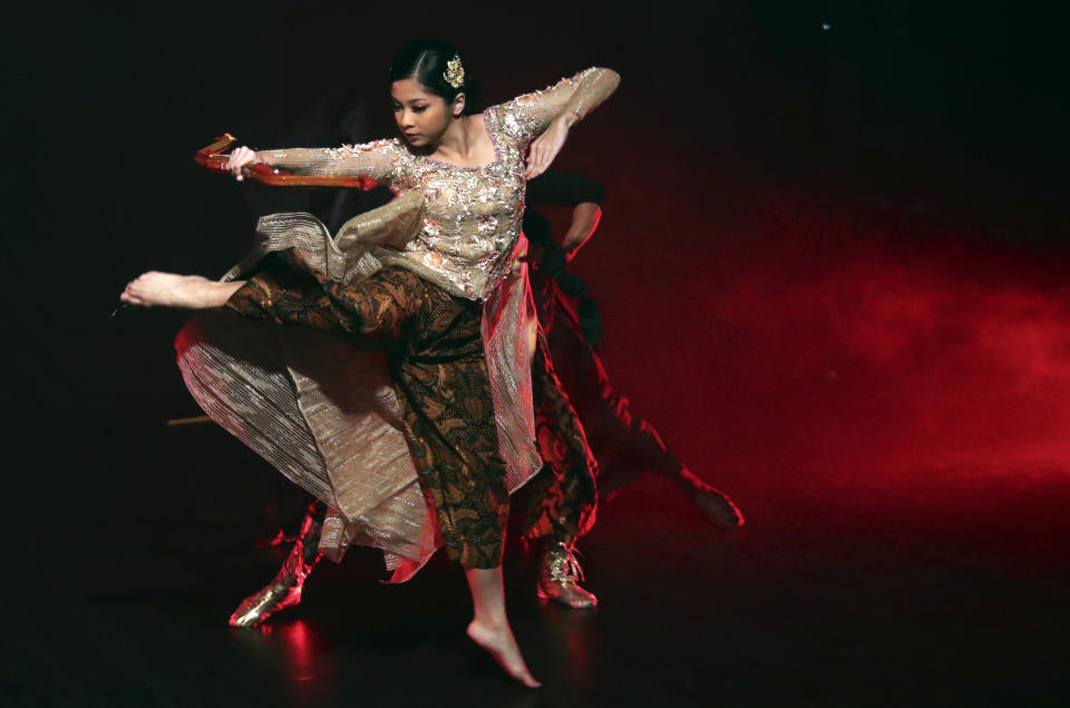 Indonesian dancer Nala Amyrtha performs during a video recording for '"Saweran Online" program on Indonesia Dance Network YouTube channel, at EKI Dance Company studio in Jakarta, Indonesia Thursday, May 14, 2020. Two Indonesian choreographers are helping fellow dancers who lost their jobs due to the new coronavirus outbreak in the country by setting up aYouTube channel as a platform where dancers, choreographers and dance teachers can perform, then receive donation from viewers. (AP Photo/Achmad Ibrahim)