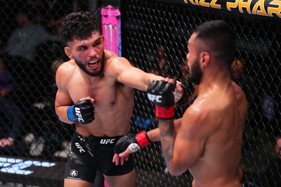 LAS VEGAS, NEVADA – MARCH 16: (L-R) Danny Silva punches Josh Culibao of Australia in their featherweight fight during the UFC Fight Night event at UFC APEX on March 16, 2024 in Las Vegas, Nevada. (Photo by Jeff Bottari/Zuffa LLC via Getty Images)