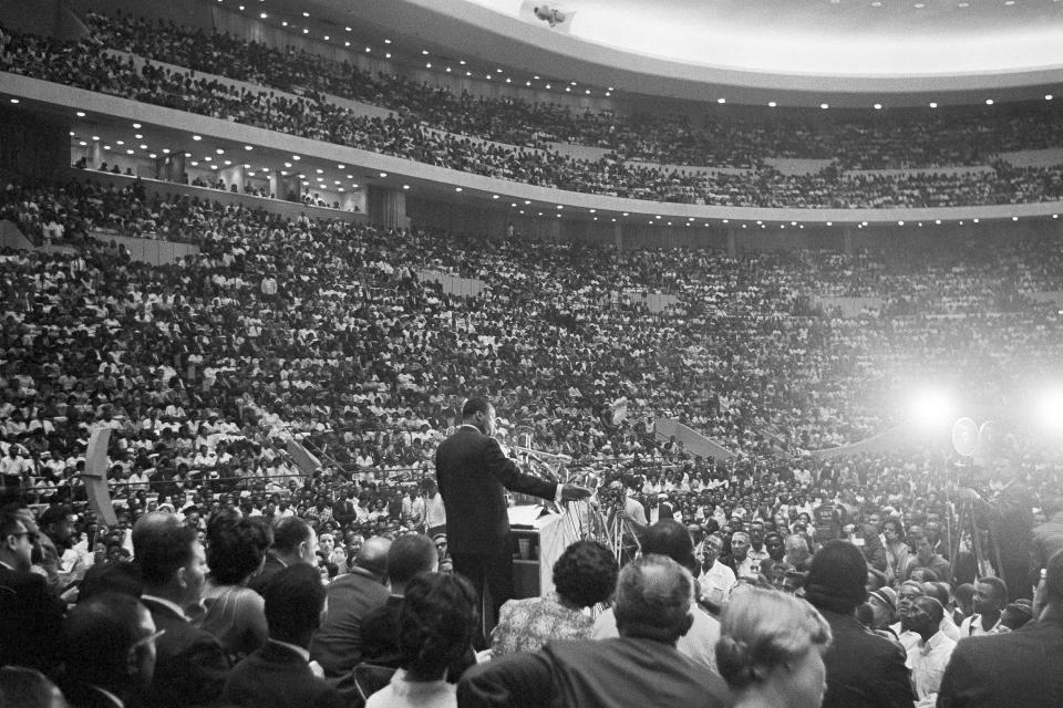 Rev. Martin Luther King Jr., speaks to an overflow crowd in Detroit's Cobo Hall Arena on Sunday, June 24, 1963, following a Freedom March.   King had been delivering versions of his “I have a dream speech” for several months, but the version he gave to more than 20,000 people inside Cobo Hall was elaborate and contained references to Detroit.
