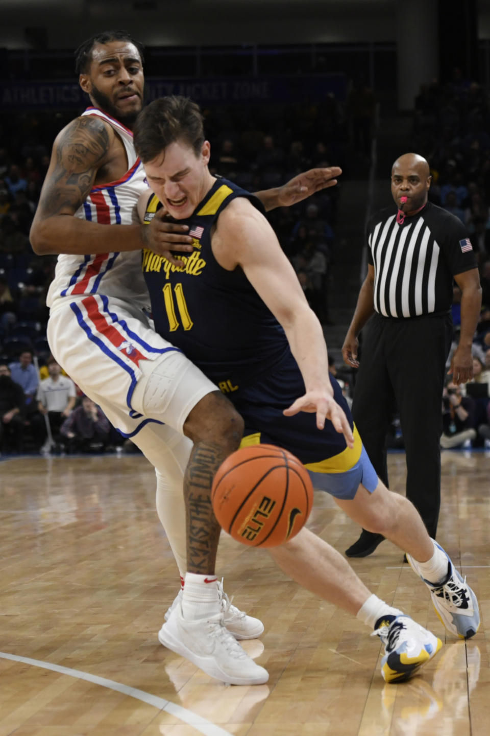 Marquette's Tyler Kolek (11) drives against DePaul's K.T. Raimey (4) during the second half of an NCAA college basketball game Wednesday, Jan. 24, 2024, in Chicago. (AP Photo/Paul Beaty)