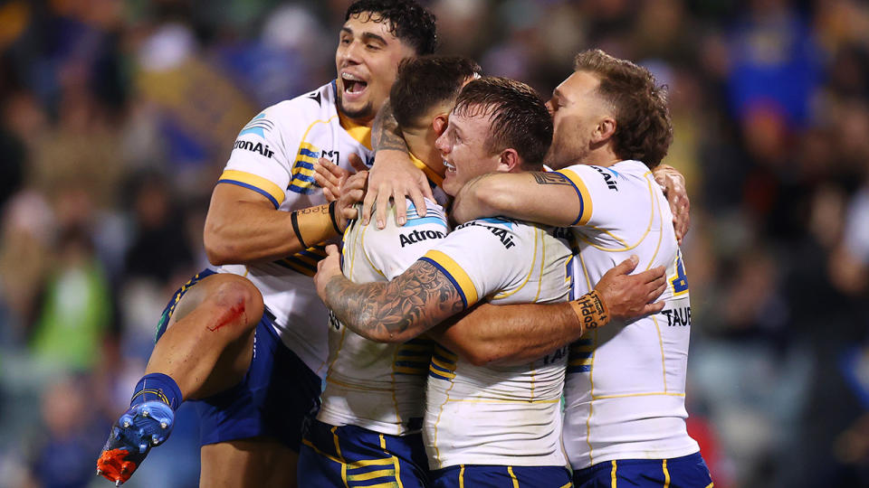 Parramatta Eels players celebrate a try.