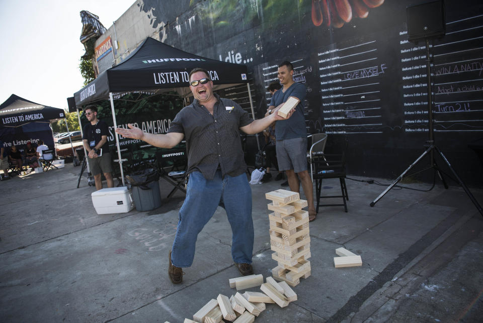 Raymond Goffin gestures after he loses a game of Jumbo Jenga.
