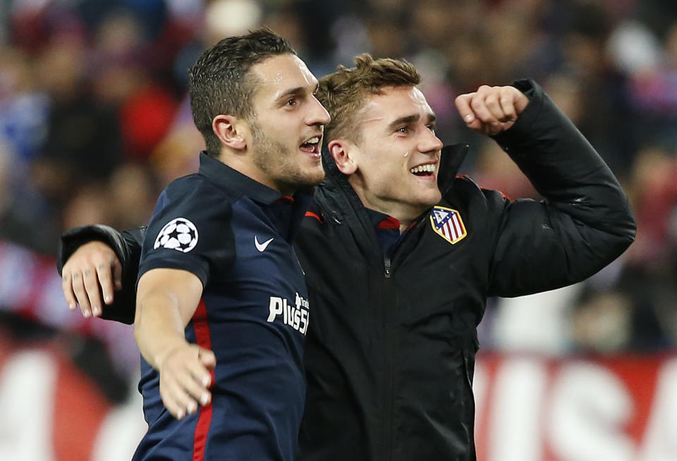 Football Soccer - Atletico Madrid v FC Barcelona - UEFA Champions League Quarter Final Second Leg - Vicente Calderon Stadium - 13/4/16 Atletico's Koke and Antoine Griezmann celebrate at the end of the game Reuters / Sergio Perez Livepic EDITORIAL USE ONLY.