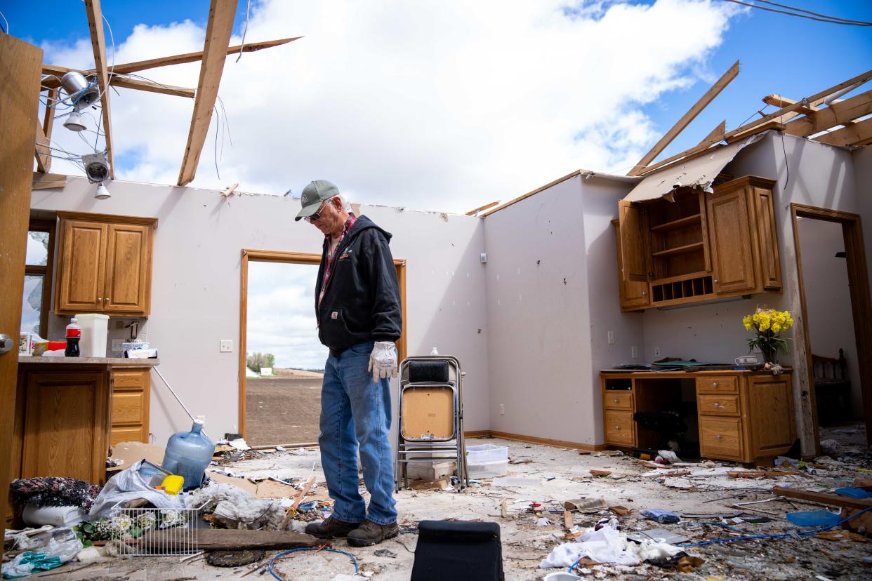 Minden resident Larry Ehlers walks through the living room of his destroyed home after a tornado Monday, April 29, 2024, in Minden, IA.