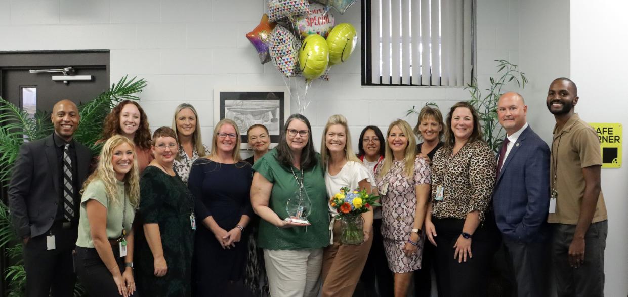 Sarasota Middle School counselor Carmen Larson (center) is honored by school and district staff for being named the 2024 Florida School Counselor of the Year.