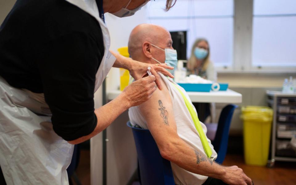 A man receives a Covid-19 booster vaccine at Midland House in Derby on 20 September 2021 - Joe Giddens/PA