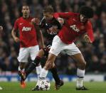 REFILE - CORRECTING SPELLING OF BAYER PLAYER'S LAST NAME Manchester United's Marouane Fellaini (R) challenges Bayer Leverkusen's Sebastian Boenisch for the ball during their Champions League soccer match at Old Trafford in Manchester, northern England September 17, 2013. REUTERS/Phil Noble (BRITAIN - Tags: SPORT SOCCER)