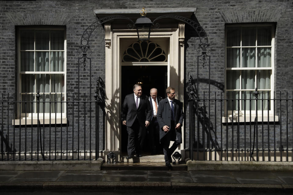 U.S. Secretary of State Mike Pompeo, left, leaves after meeting British Prime Minister Theresa May at 10 Downing Street in London, Wednesday, May 8, 2019. U.S. Secretary of State Mike Pompeo is in London for talks with British officials on the status of the special relationship between the two nations amid heightened tensions with Iran and uncertainty over Britain's exit from the European Union. (AP Photo/Matt Dunham)