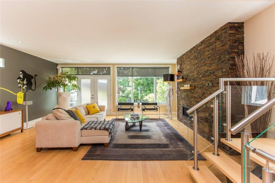 <p><span>546 Hilson Avenue, Ottawa, Ont.</span><br> The modern, open-concept home has hardwood floors throughout and a gas fireplace nestled in a cultured stone wall.<br> (Photo: Zoocasa) </p>