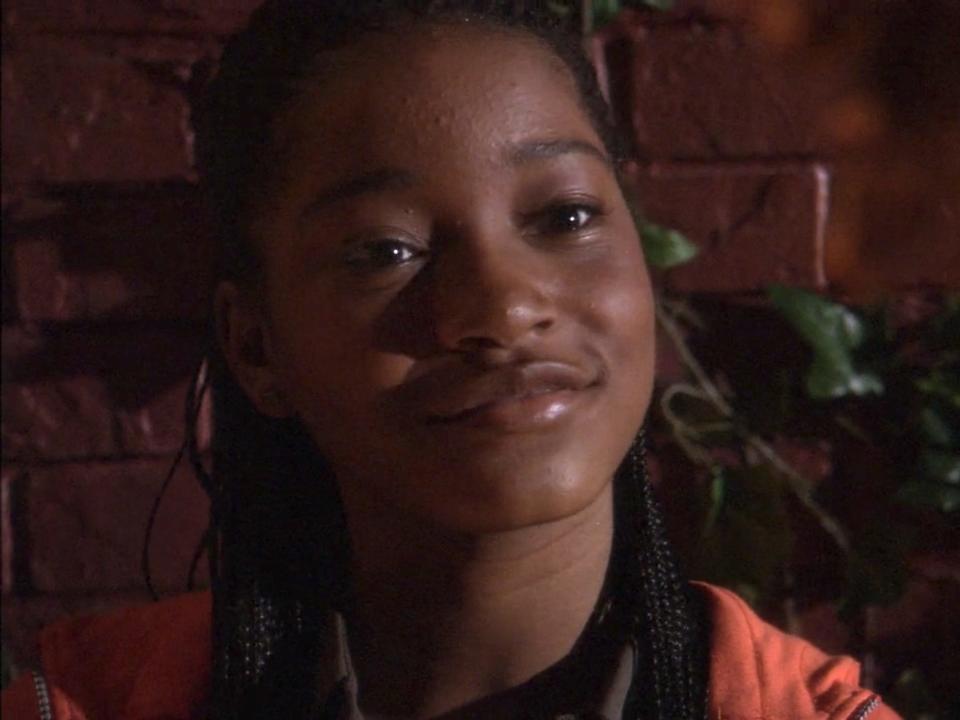 Keke Palmer wearing a red shirt in Jump In