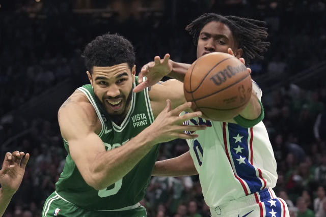 Jayson Tatum of the Boston Celtics drives down court during the