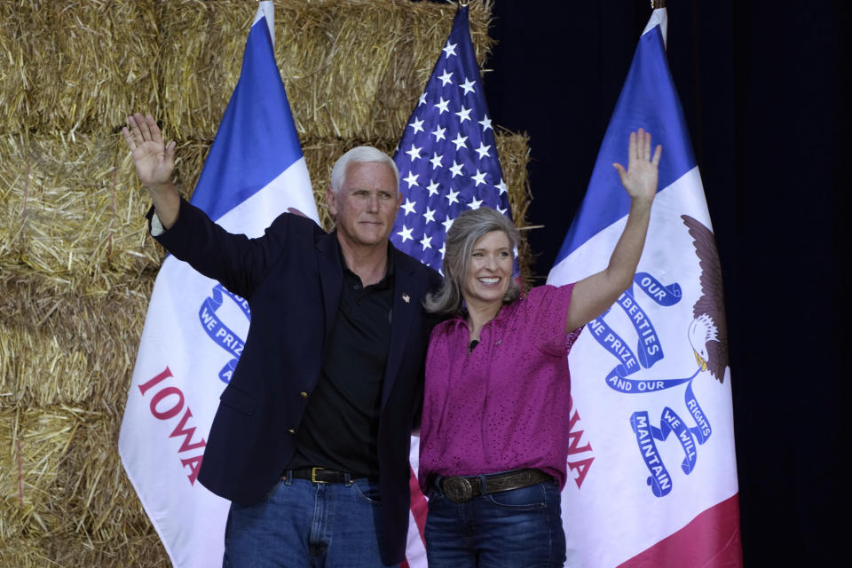 Former Vice President Mike Pence stands on stage with U.S. Sen. Joni Ernst, R-Iowa, during her Roast and Ride, Saturday, June 3, 2023, in Des Moines, Iowa. (AP Photo/Charlie Neibergall)