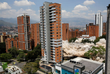 The Monaco building (R) and former home of the late drug lord Pablo Escobar is being demolished, in Medellin, Colombia February 22, 2019. REUTERS/David Estrada Larraneta