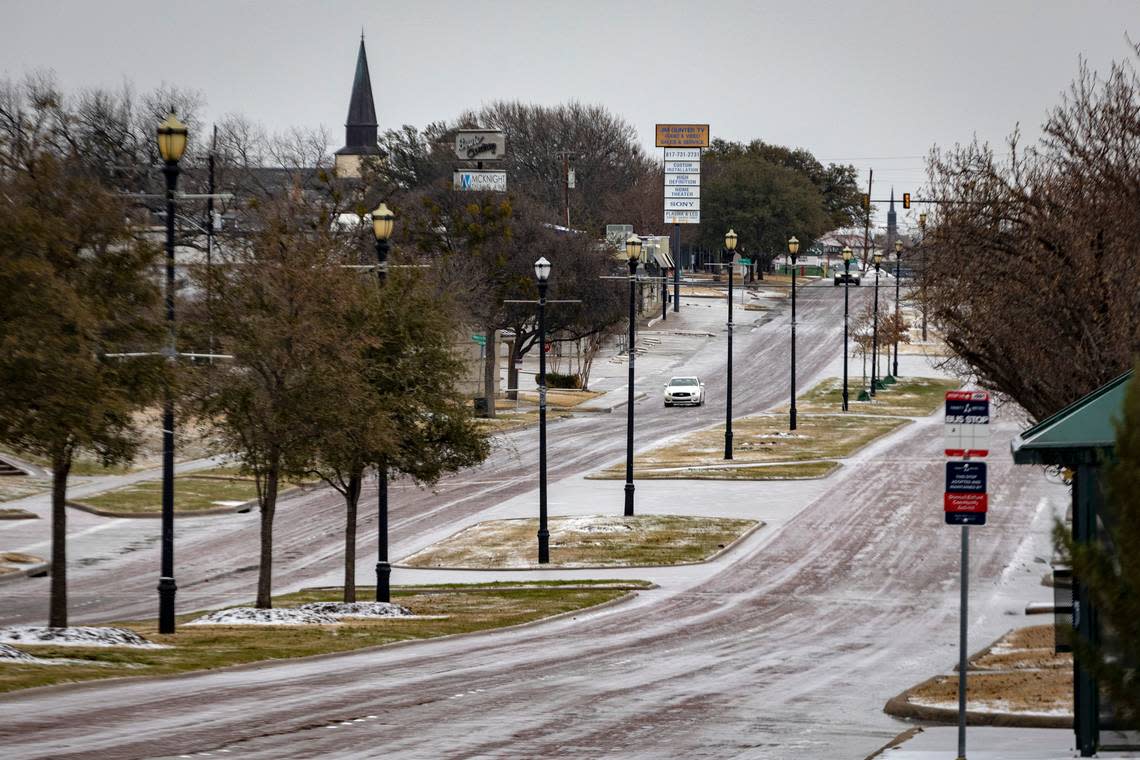 Cars drive on icy roads down Camp Bowie Boulevard in Fort Worth on Wednesday, Feb. 1, 2023. Tarrant County is one of many in North Texas under an ice storm warning until 9 a.m. Thursday morning.