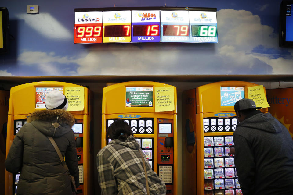 FILE - In this Jan. 12, 2016, file photo, people buy lottery tickets at the Primm Valley Casino Resorts Lotto Store just inside the California border near Primm, Nev. The California Lottery announced in June 2017 that a 19-year-old woman won a total of $655,555 on a pair of $5 scratch-off tickets purchased the same week. (AP Photo/John Locher, File)