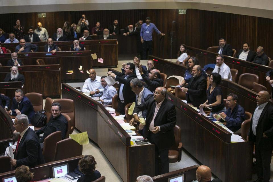 Arab lawmakers stand up in protest (AP)